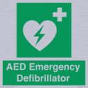 green-background-with-white-text-and-heart-defibrillator-symbol--white-cross-and~